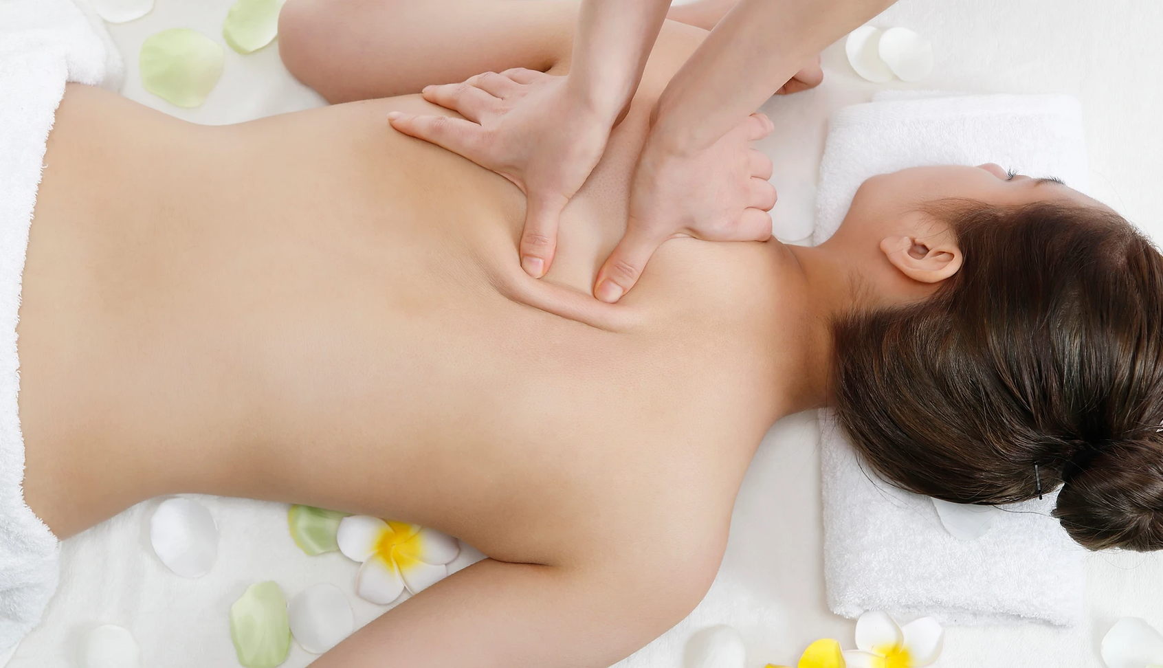 a person getting a back massage at a spa