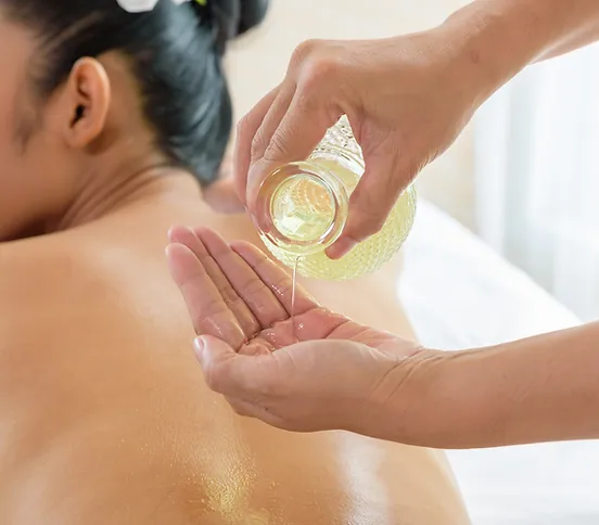 a person getting a massage with oil on their back at Phanom Thai Massage 